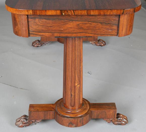 TooveysAn early Victorian rosewood centre table, fitted with two frieze dra