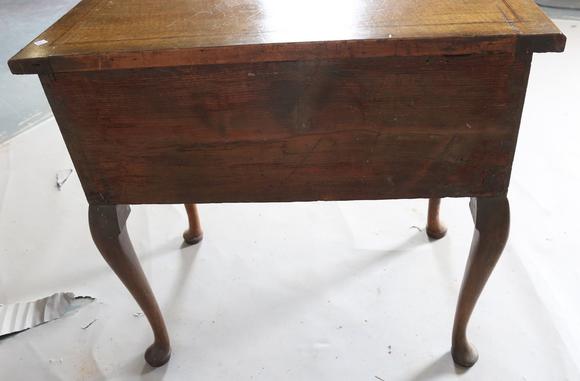 TooveysAn 18th century and later walnut lowboy, fitted with three oak-lined