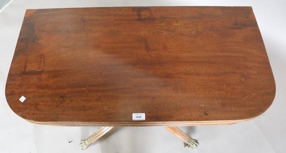 TooveysA Regency mahogany fold-over tea table, raised on a spiral reeded st