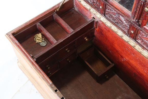 TooveysA 20th century Burmese hardwood trunk, the hinged lid inset with arc