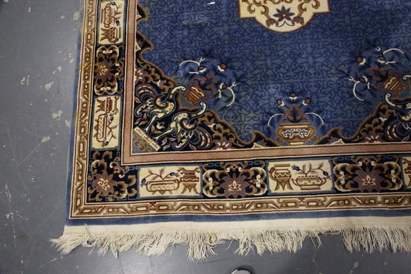 TooveysA Chinese carpet, late 20th century, the blue field with a floral me