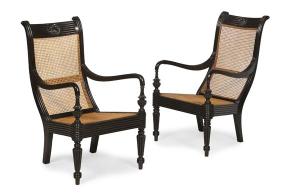 DreweattsY A CLOSELY MATCHED PAIR OF CEYLONESE CARVED EBONY ARMCHAIRS, FIRST HALD 19TH CENTURY