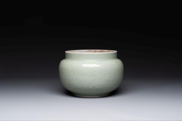 Rob Michiels AuctionsA Chinese celadon-glazed bowl with incised chilong among floral scrolls, Kangxi