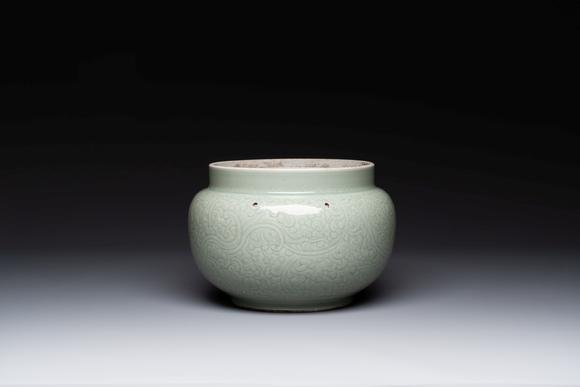 Rob Michiels AuctionsA Chinese celadon-glazed bowl with incised chilong among floral scrolls, Kangxi