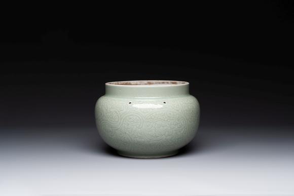 Rob Michiels AuctionsA Chinese celadon-glazed bowl with incised chilong among floral scrolls, Kangxi