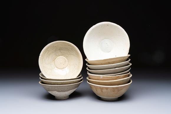 Rob Michiels AuctionsA group of 12 Chinese celadon-glazed bowls with incised floral design from the Jepara shipwreck, Fujian kilns, Song
