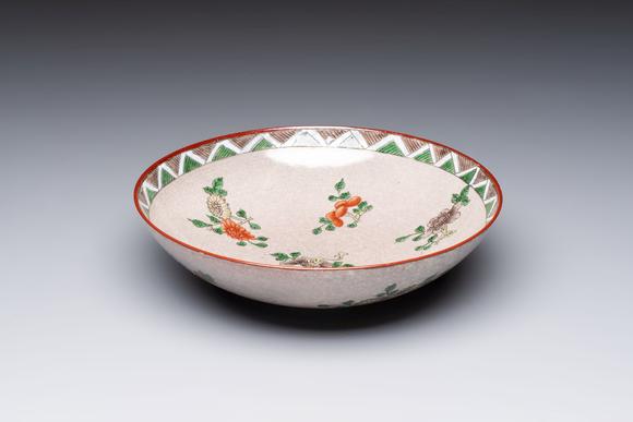 Rob Michiels AuctionsAn unusual Chinese famille verte copper-red-ground shallow bowl with floral design, 19th C.