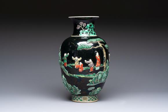 Rob Michiels AuctionsAn unusual Chinese famille noire vase with relief design, Kangxi mark, 19th C.