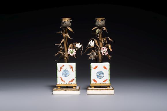 Rob Michiels AuctionsA pair of gilt silver and metal candlesticks with Chinese porcelain, European porcelain flowers, and marble bases, marked Boin-Taburet, late 19th C.