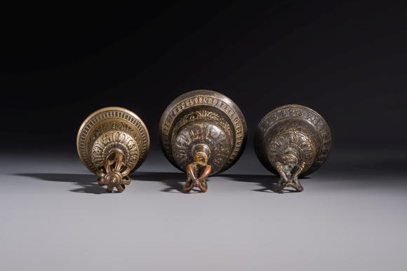 Rob Michiels AuctionsThree Tibetan bronze ritual bells and a bronze Buddha, 19th C.