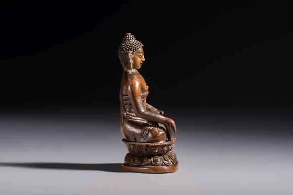 Rob Michiels AuctionsThree Tibetan bronze ritual bells and a bronze Buddha, 19th C.