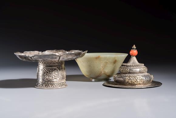 Rob Michiels AuctionsA Tibetan ritual jade bowl with a red coral-mounted silver cover and a stand, 19th C.