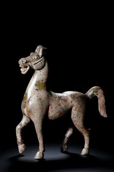 A Jade Walking Horse Sculpture with Grey-Red Patina, 2nd BCE–3rd CE