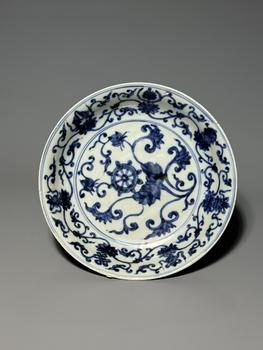 A Blue and White Circular Dish with Dharma Wheel and Floral Scroll Medallion, China, 14th–17th century