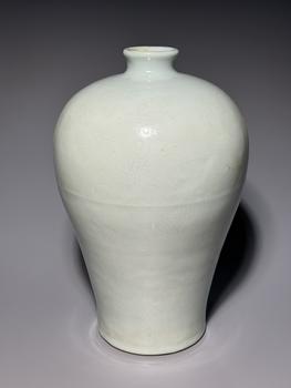 A White Porcelain Meiping Vase with Incised Dragon and Cloud Patterns, China, 18th century