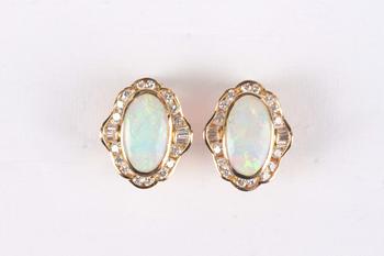 A pair of gold, opal and diamond shaped oval earrings, each collet set with the oval opal within a surround of tapered baguette and circular cut diamo