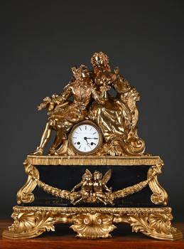 Large Louis-Philippe mantel clock in gilded bronze…