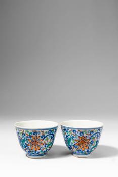 Qing Dynasty, Ca. AD 1644 - 1912. >
A delicate pair of porcelain cups of gently flared form, each