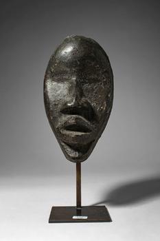 Ca. late 19th - early 20th century AD. >
A passport mask carved in wood of elongated oval form, t