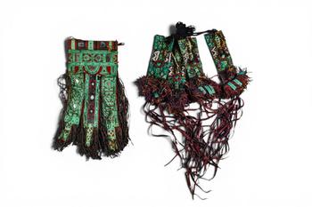 Ca. 20th century AD. >
A group of two textile costume elements, each richly embellished with poly