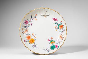 Mid Qing Dynasty, Ca. 18th century AD. >A famille rose porcelain dish of shallow, lobed form with