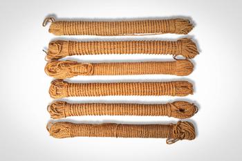 Ca. 19th - 20th century AD. >
A group of coiled fibre fishing lines or cordage, each tightly woun