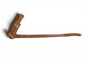 Ca. 20th century AD. >
A wooden adze pounder of characteristic L-shaped form, the long, slightly