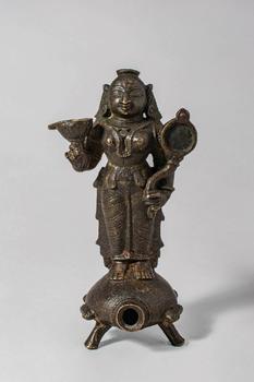 Ca. 14th-15th century AD. A bronze oil lamp cast in the form of Goddess Lakshmi, the consort of V