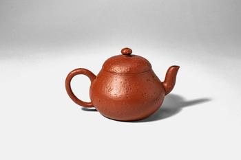 Qing Dynasty, Ca. AD 1644 - 1912. >
A teapot of the classic Junde form, the rounded body rising g