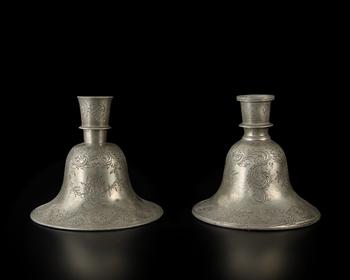 A pair of engraved tinned bell-shaped huqqa bases in the European taste,?
India, late 19th century,?

the decoration consisting of exuberant leaf