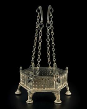 An cast bronze brazier,
Possibly North or Central India, 17th century-18th century,

of hexagonal form and on six feet, each of the six panels perf