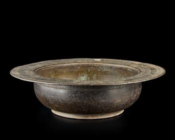 A Mughal engraved basin,?
North India, second half 18th century or later,

Of deep form, with rounded cavetto and wide flat lip, two bands of repe