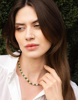 AN EMERALD AND DIAMOND LINE NECKLACE