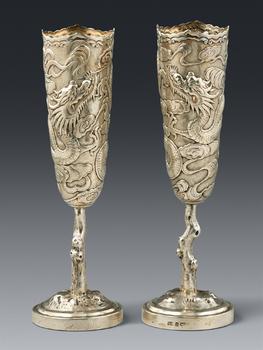 A pair of Wang Hing silver vases. Hong Kong. Around 1900