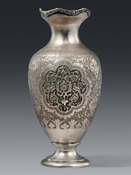 An Persian ornate silver repoussé vase. Probably 19th century