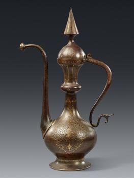 An elegant Qajar gold damascened steel ewer. 19th century