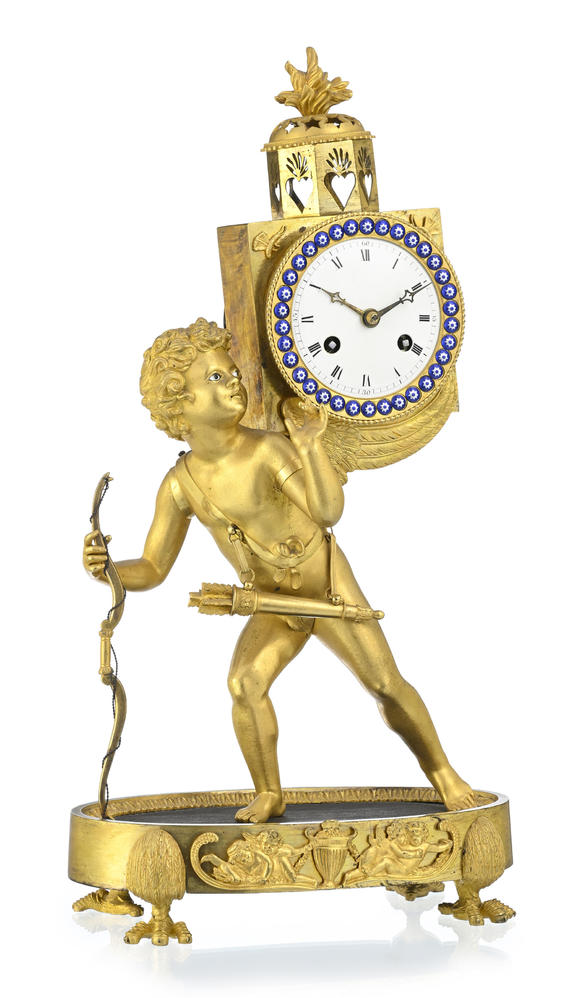Piguet - H?tel des VentesPendule dite à lanterne magique d'époque Restauration, en bronze doré et finement ciselé, 47x25x14 cm