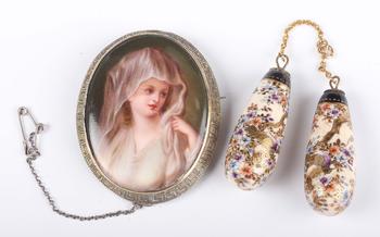 A Continental oval porcelain brooch, painted with a portrait of a ma