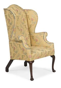 A GEORGE II MAHOGANY AND UPHOLSTERED WING ARMCHAIR, CIRCA 1740