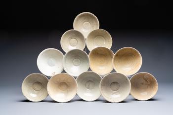 A group of 12 Chinese celadon-glazed bowls with incised floral design from the Jepara shipwreck, Fujian kilns, Song