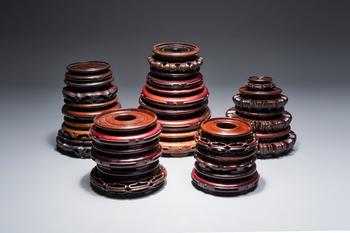 A collection of 20 Chinese wooden stands, 19/20th C.
