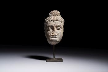 A Gandhara grey schist relief fragment of a Bodhisattva head, 3rd/4th C.