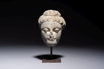 A Gandhara grey schist relief fragment of a Bodhisattva head, 3rd/4th C.