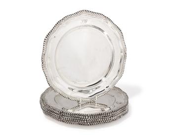A set of nine Elizabeth II silver dinner plates.?

Garrard & Co.,