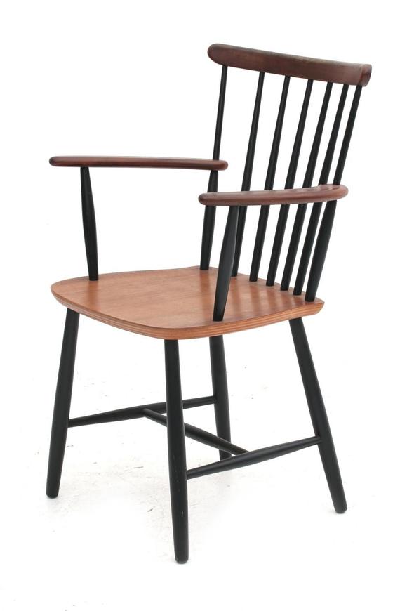 A teak and partly ebonised wooden peg chair with armrests, 1960s