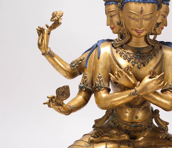 liaodu art auction清代铜鎏金三头六臂佛造像  a bronze gilt three