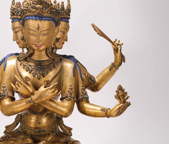 liaodu art auction清代铜鎏金三头六臂佛造像  a bronze gilt three